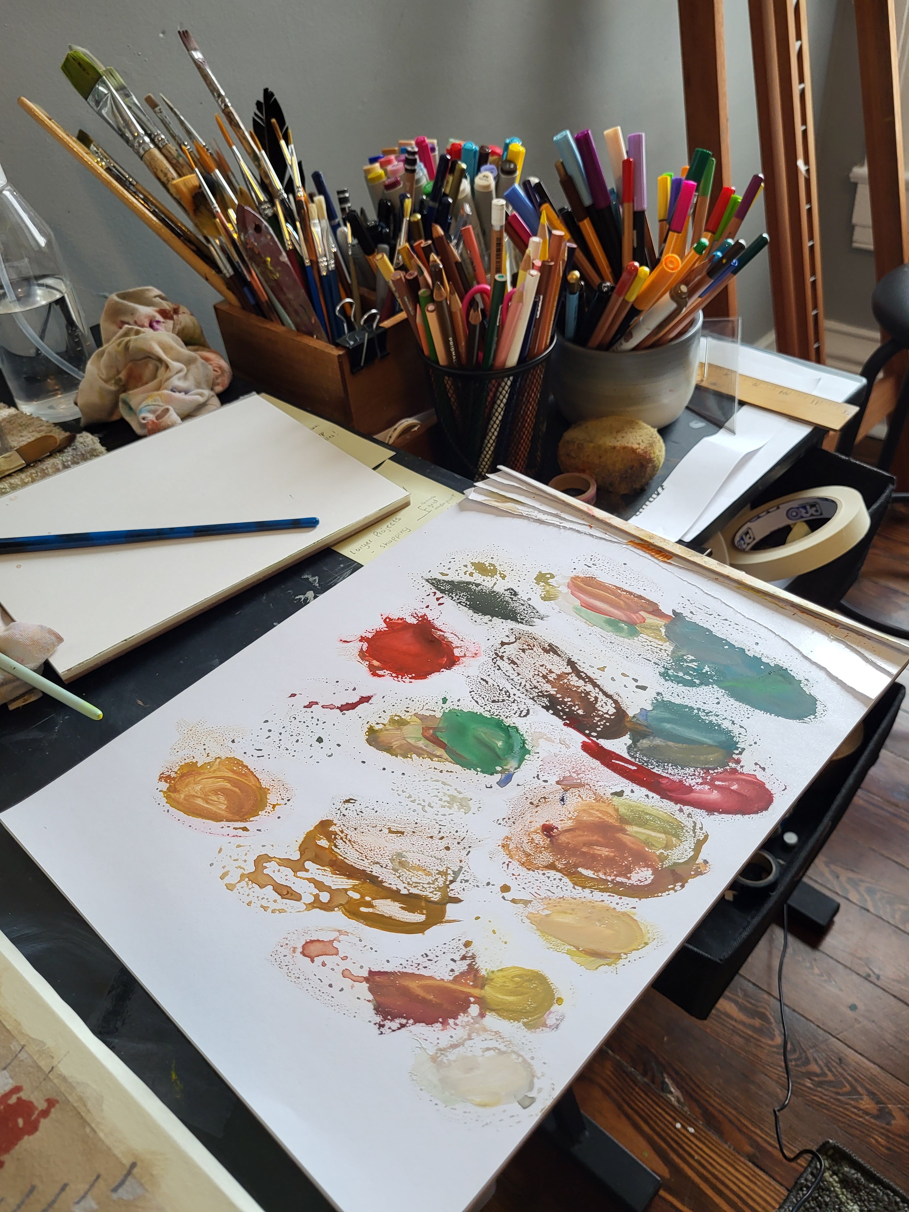 Colorful paint palette and brushes in my home art studio
