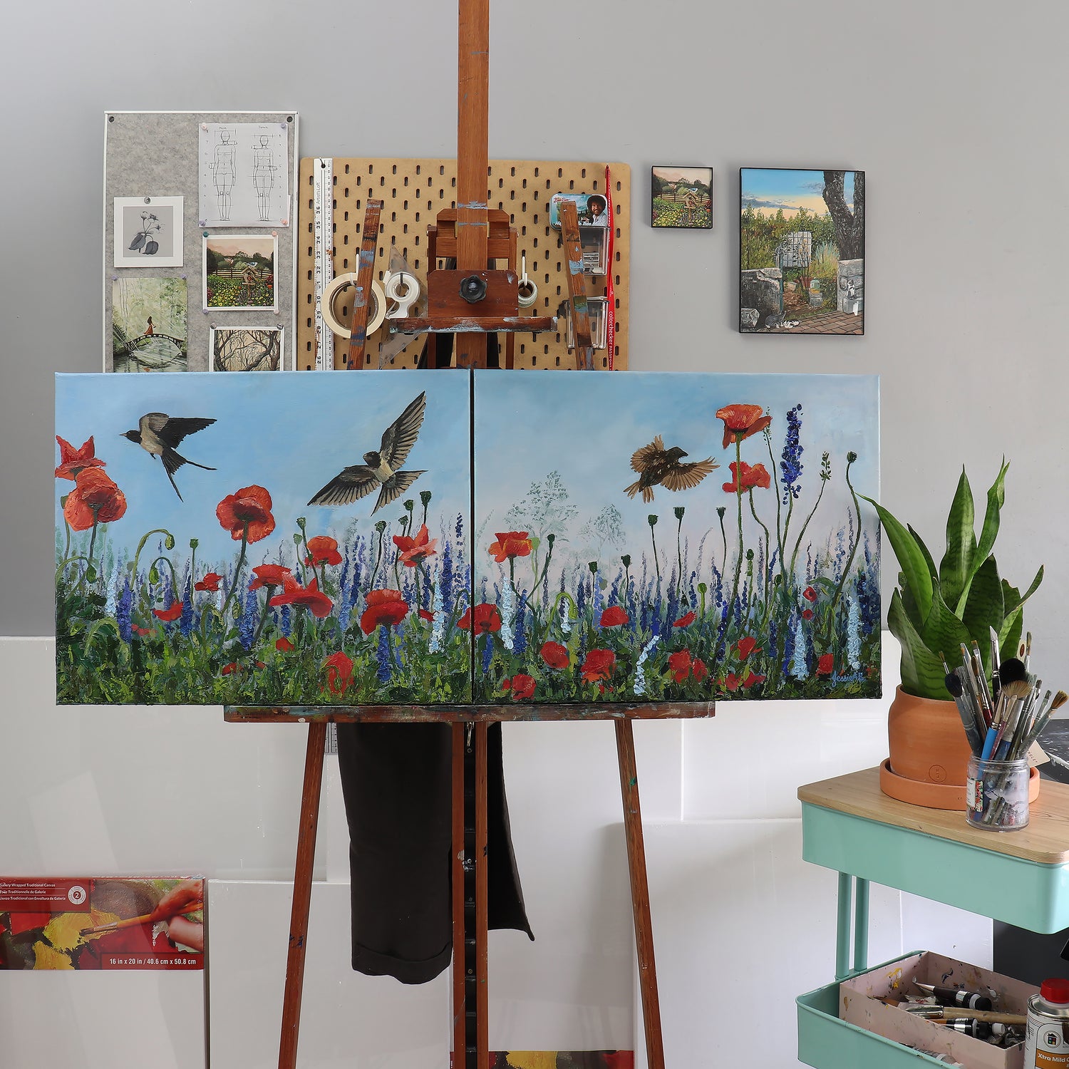 Original painting by Jessie Bettersworth of swallows flying through fields of poppy wildflowers